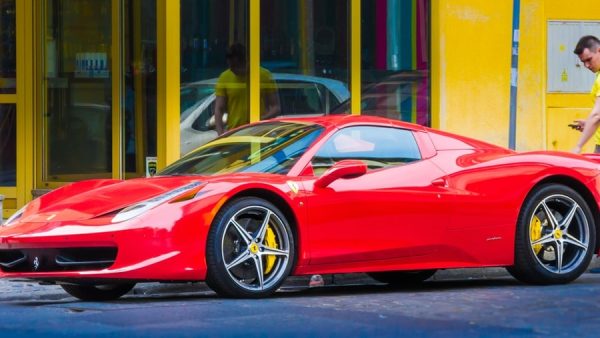 Red ferrari supercar in ways